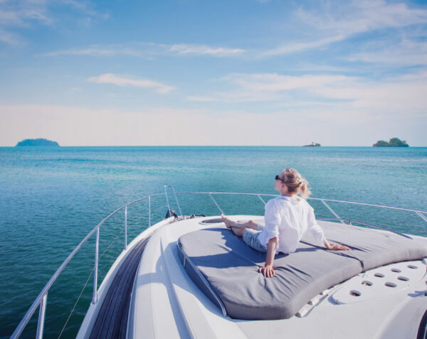 beautiful woman enjoying luxurious yacht cruise, sea travel by luxury boat